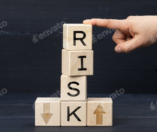 Preview: Wooden cubes with the inscription risk on a blue background. Risk reduction concept, reinsurance