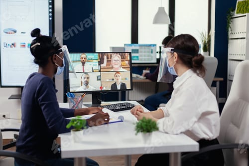 Preview: African employee and manager discussing on video conference