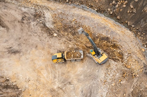 Preview: Heavy industrial excavator digs the ground and transfers it to the truck