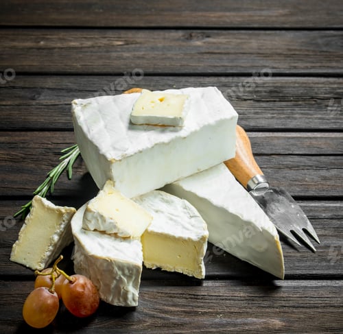 Preview: Brie cheese with knife.