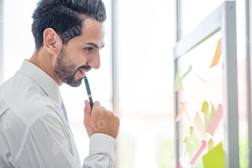 Preview: business man hold pen to post it for idea analysis and planning marketing,goal to success