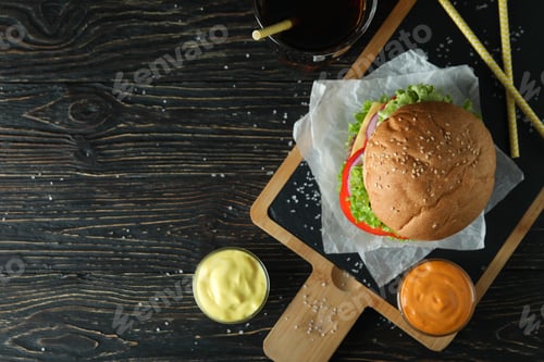 Preview: Concept of tasty food with delicious burger