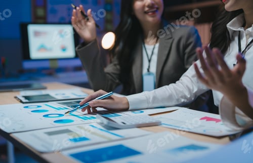 Preview: Business professionals analyzing data in modern office