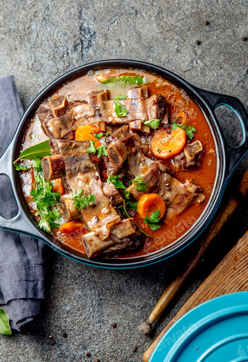 Preview: Beef ribs Bourguignon. Beef ribs stewed with carrot, onion in red wine. France dish. Top view