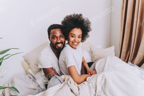 Preview: Afro american couple in bed at home