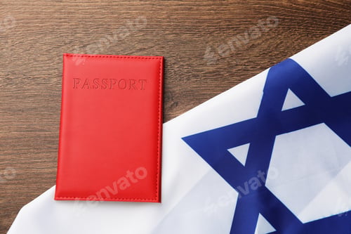 Preview: Passport in red cover and flag of Israel on wooden table, top view