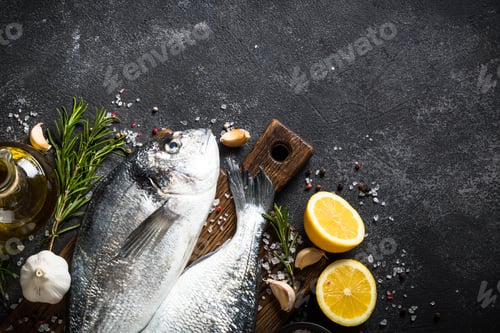 Preview: Fresh fish dorado on black stone table