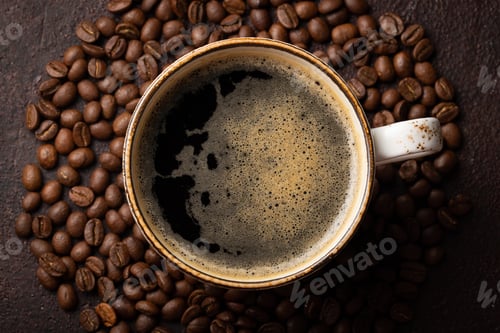 Preview: Close-up of a Cup of black coffee and coffee beans on a dark background. Top view. Flat lay