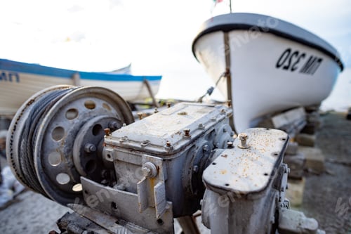 Preview: Winch with a rope on a pier with boats and boats against the sky