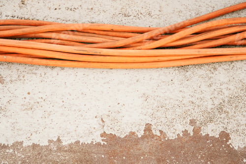 Preview: Orange cables in a row, on a white background