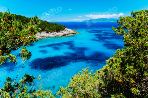 Preview: Azure hidden bay on greek island. Crystal clear water on sunny summerday