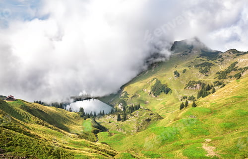 Preview: dense fog starts to cover alpine lake