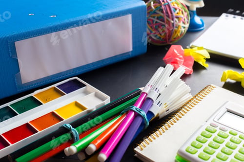 Preview: Desk of an artist with lots of stationery objects