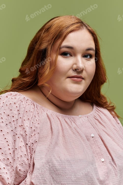 Preview: A Portrait of Confidence: A Plus Size Woman in a Delicate Pink Blouse