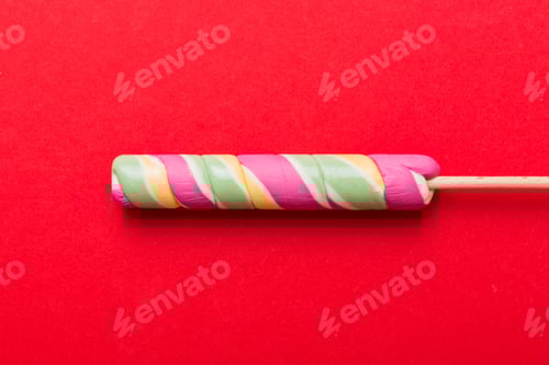 Preview: Colorful candies, lollypop on the colorful background, multicolored minimal style top view