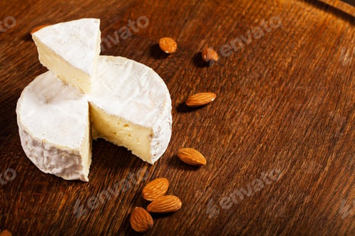 Preview: Camembert cheese or brie on wood background