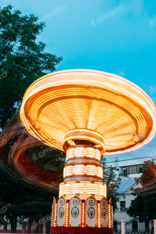 Preview: Blurred Motion Effect Of Illuminated Rotating Carousel Merry-Go-