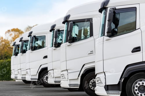 Preview: Fleet of new modern electric hybrid hydrogen or diesel white trucks parked in line row outdoors