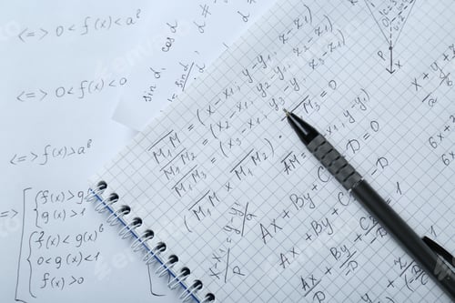 Preview: Notebook with different mathematical formulas and pen, top view