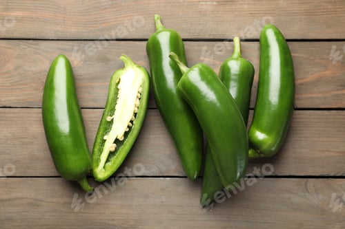 Preview: Fresh jalapeno peppers on wooden table, top view