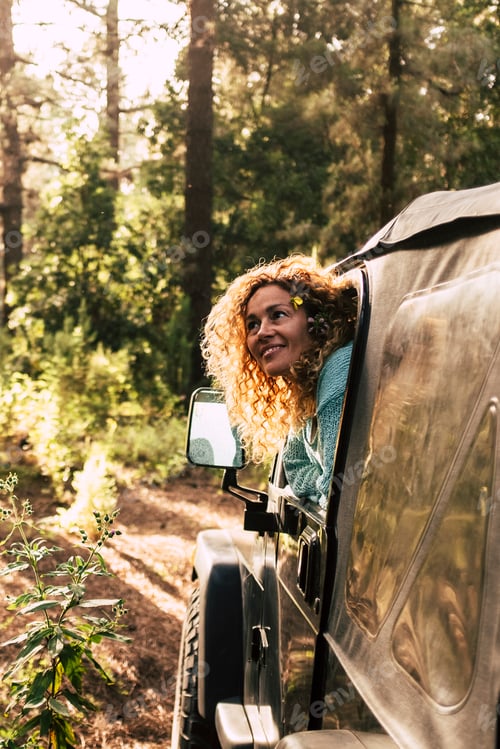 Preview: Alternative tourism people discover nature with off road car enjoying the forest and wood