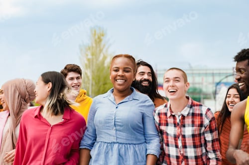 Preview: Group of people smile together in city street. Young friends having fun in travel vacations
