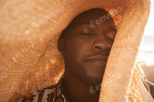 Preview: African American Man in Straw Hat Enjoying Sunlight