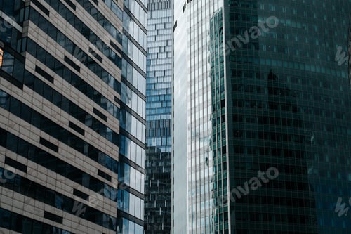 Preview: Front view of modern skyscrapers offices exterior, close-up of business district glass windows