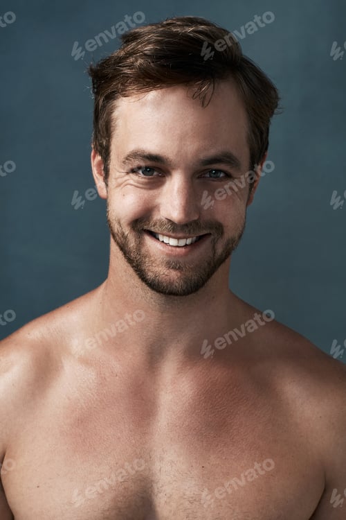 Preview: Cropped portrait of a handsome young man against a grey background