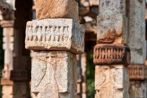 Preview: Stone columns with decorative bas relief of Qutb complex in South Delhi, India, close up pillars