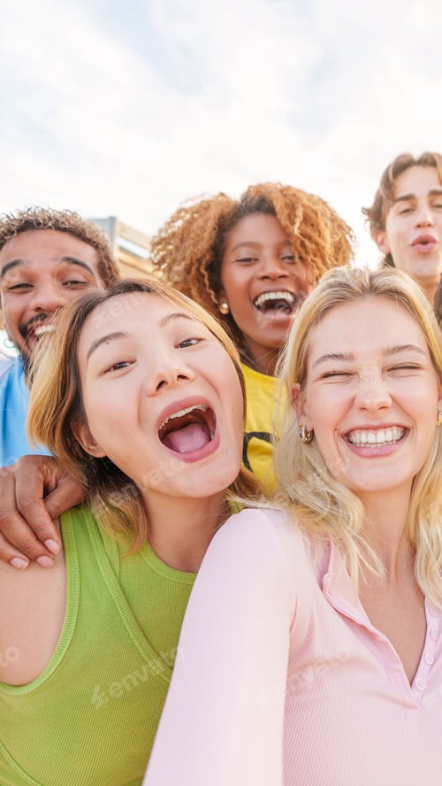 Preview: Multiethnic group of friends taking a happy selfie