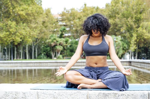 Preview: Shot of a woman doing yoga in a park