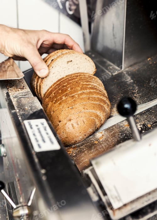 Preview: Baker with loaf of sliced bread