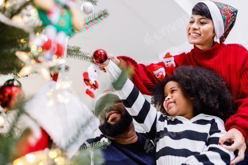 Preview: Family Decorating the Christmas Tree with Ornaments