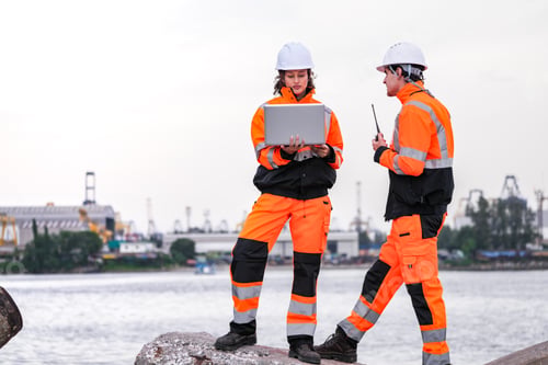 Preview: engineers communicate while inspecting dockside logistics