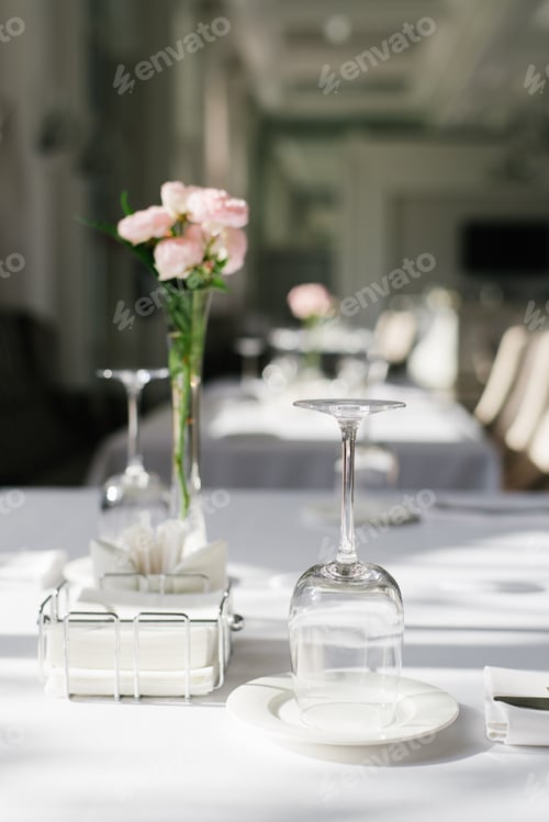 Preview: Glassware And Flowers On Table