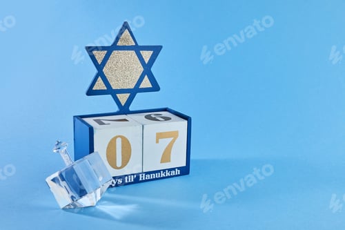 Preview: Hanukkah Countdown Calendar. Hanukkah Calendar with David star and dreidel.