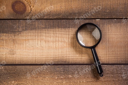 Preview: magnifying glass on the wooden background