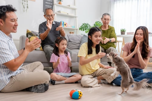 Preview: Asian family spending quality time together in living room at home.