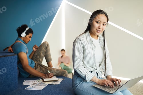 Preview: Asian student girl using wifi in hall
