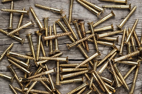 Preview: Yellow Screws On The Wooden Table