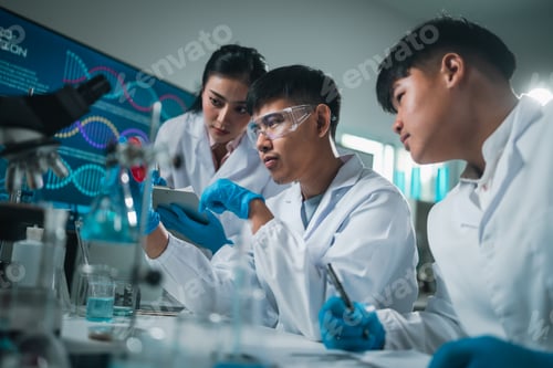 Preview: Medical research teamwork in laboratory using microscope and blood test tubes for DNA analysis