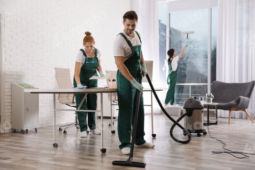 Preview: Team of professional janitors working in modern office. Cleaning service
