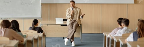 Preview: University Professor Speaking in Microphone Giving Lecture on Law in Classroom