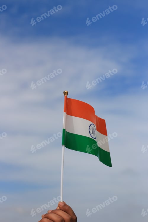 Preview: Vertical shot of the Indian flag in the blue sky