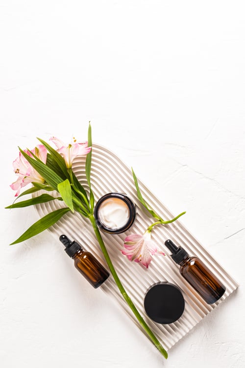 Preview: A set of cosmetics for face and body skin care in various bottles on a plaster podium.Beauty concept