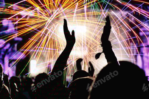 Preview: Crowd Cheers Fireworks Celebration at Night