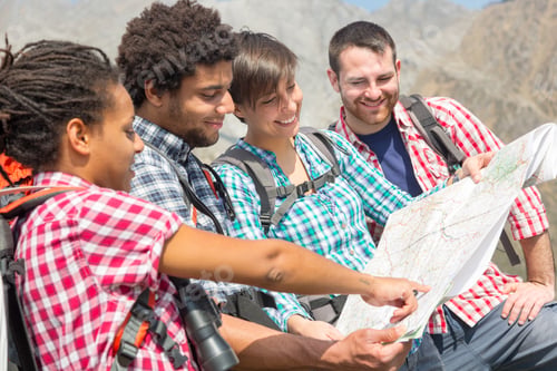 Preview: Hikers Looking at Map on top of Mountain