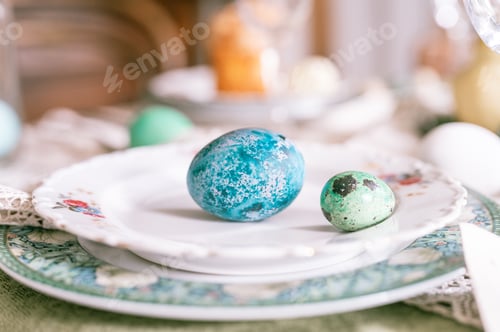 Preview: happy easter holiday in springtime season. painted green emerald colored eggs in bowl and plate on t