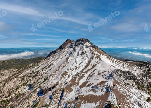 Preview: Scenic view of the snow-covered mountain against the blue sky. Nevado de Colima, Mexico